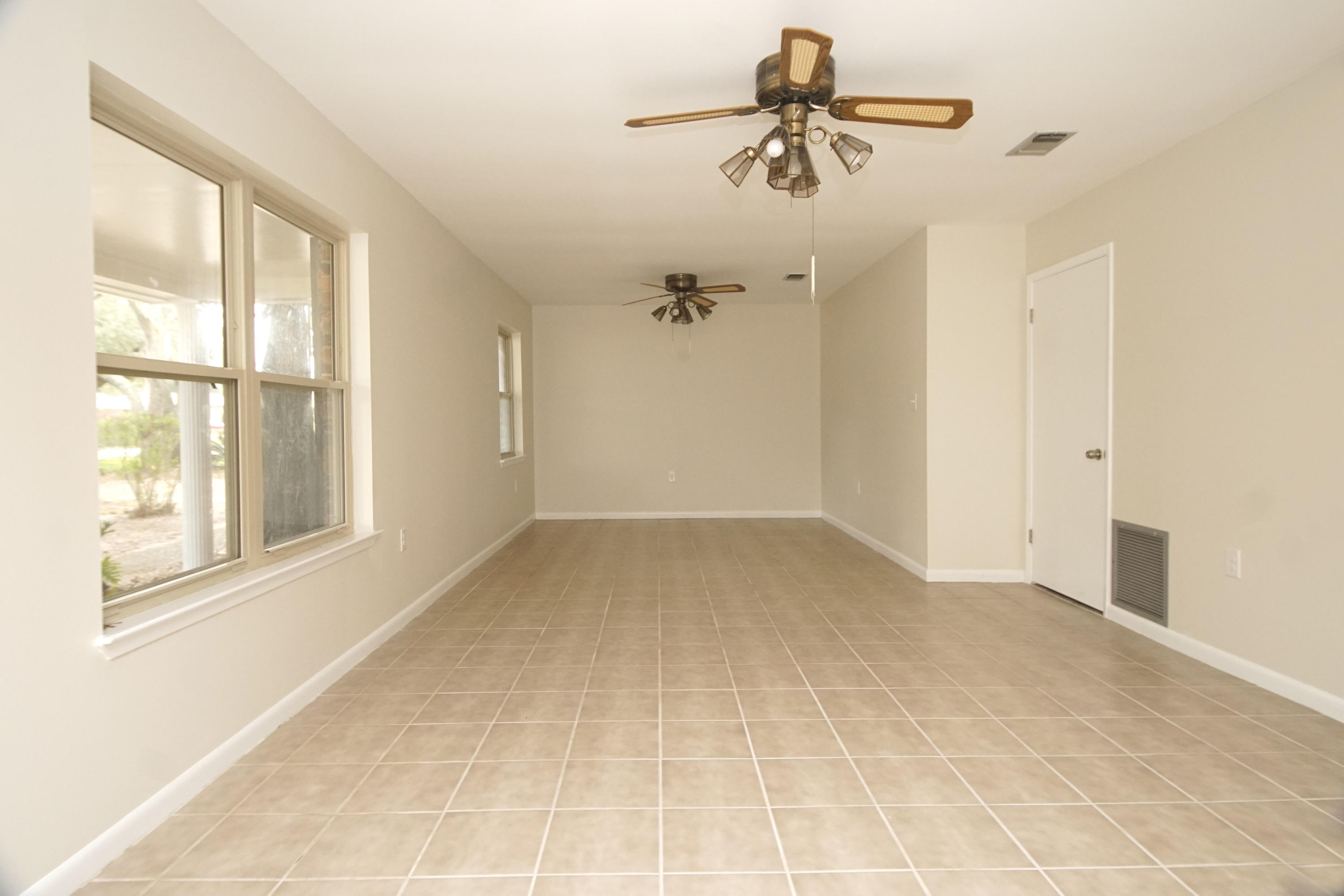 115 Country Club Road Shalimar, FL 32579 - Photo 5 of 25 a view of an empty room with a window