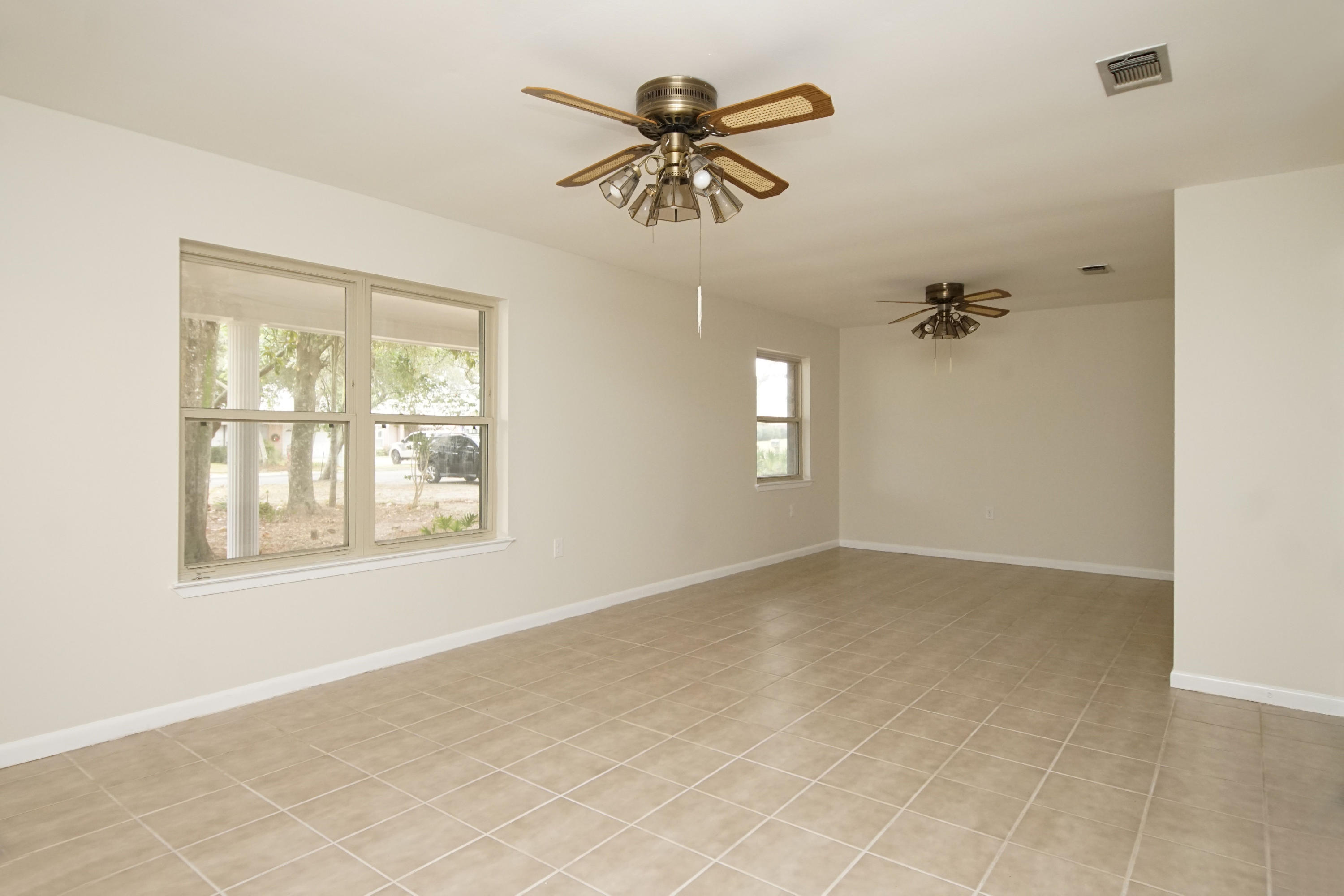 115 Country Club Road Shalimar, FL 32579 - Photo 6 of 25 a view of an empty room with a window