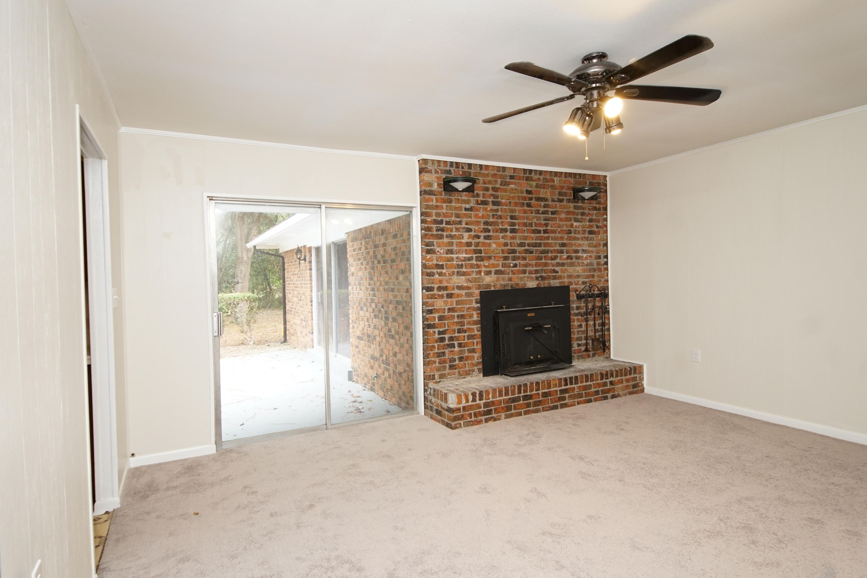 115 Country Club Road Shalimar, FL 32579 - Photo 9 of 25 an empty room with fan and windows