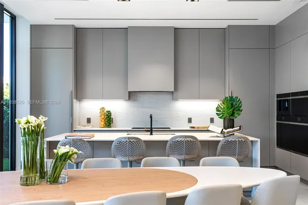 a view of a swimming pool with chairs in patio