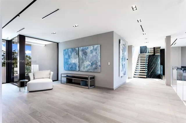 an aerial view of a house with outdoor space swimming pool and lake view