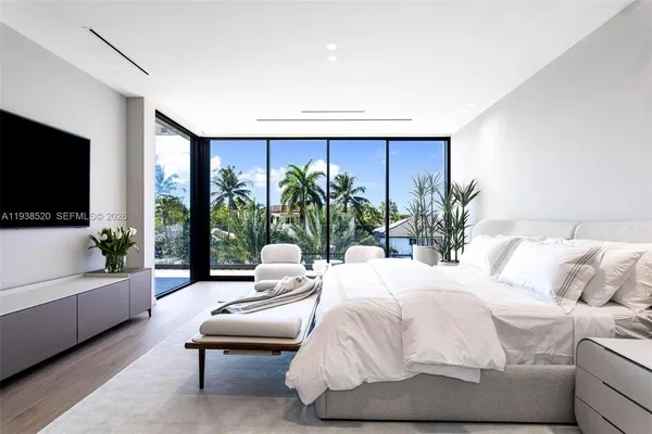 an aerial view of a house with outdoor space swimming pool and lake view