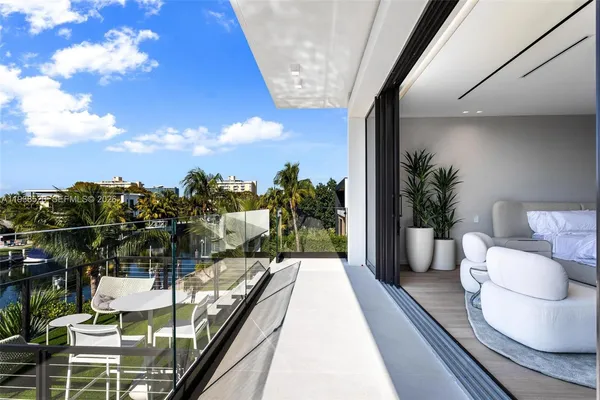 a view of a patio with couches and city view