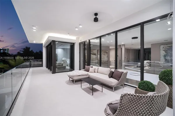 a view of a balcony with chairs