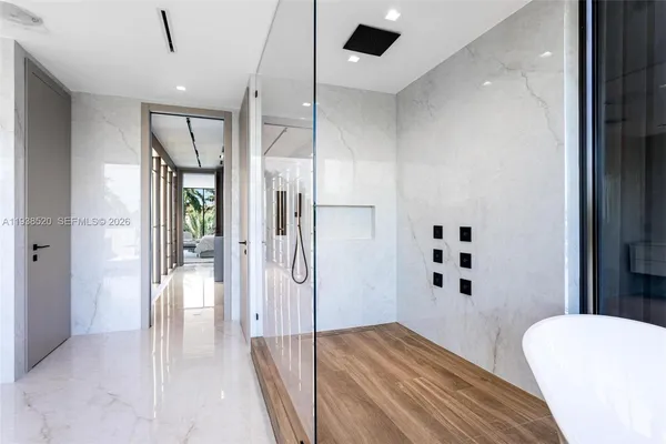 a front view of a house with plants