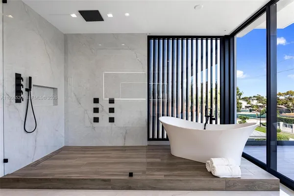 a view of a balcony with chairs and a table