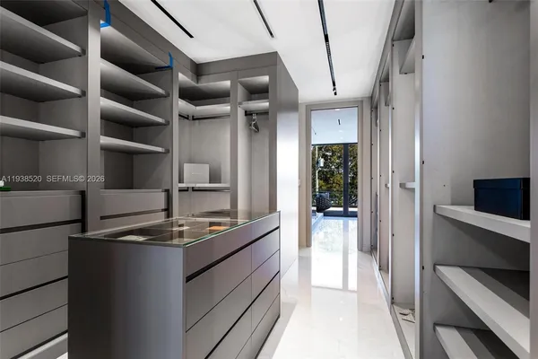 a view of a chairs and table in a patio