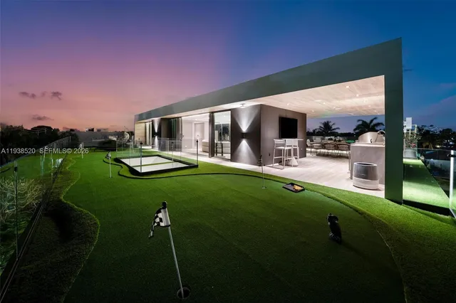 a living room with furniture and potted plants