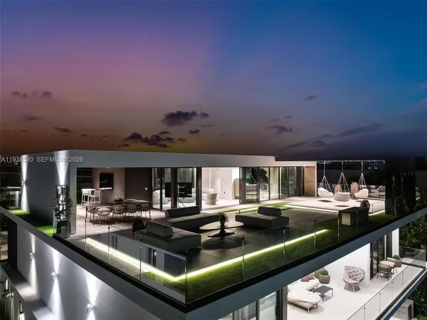 a dining room with furniture a large window and a table