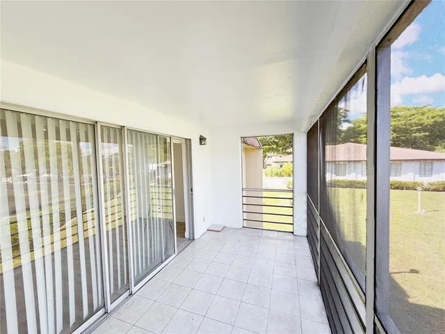 a view of a room with windows