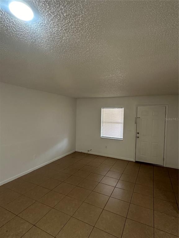 2218 Leo Drive, Unit B Auburndale, FL 33823 - Photo 4 of 9 a view of an empty room and window