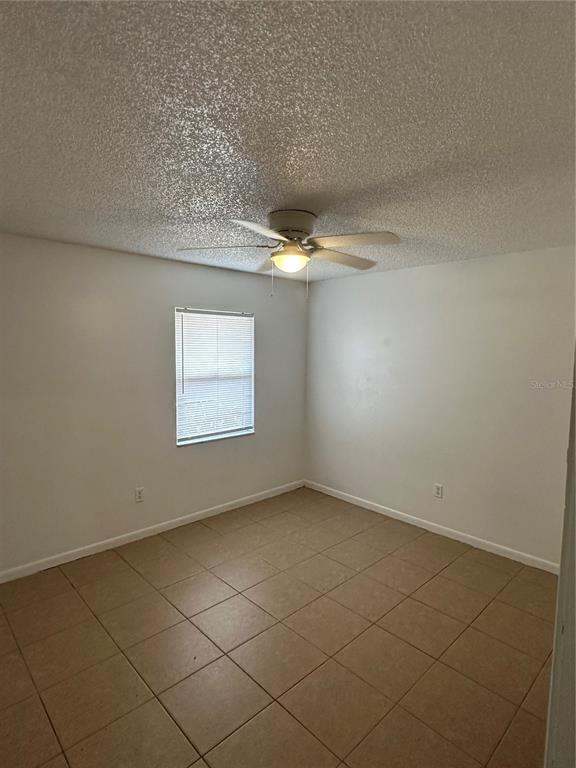 2218 Leo Drive, Unit B Auburndale, FL 33823 - Photo 7 of 9 a view of an empty room and a window