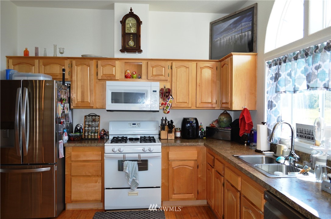 7855 Ham Road Custer, WA 98240 - Photo 11 of 39 a kitchen with a refrigerator stove and sink
