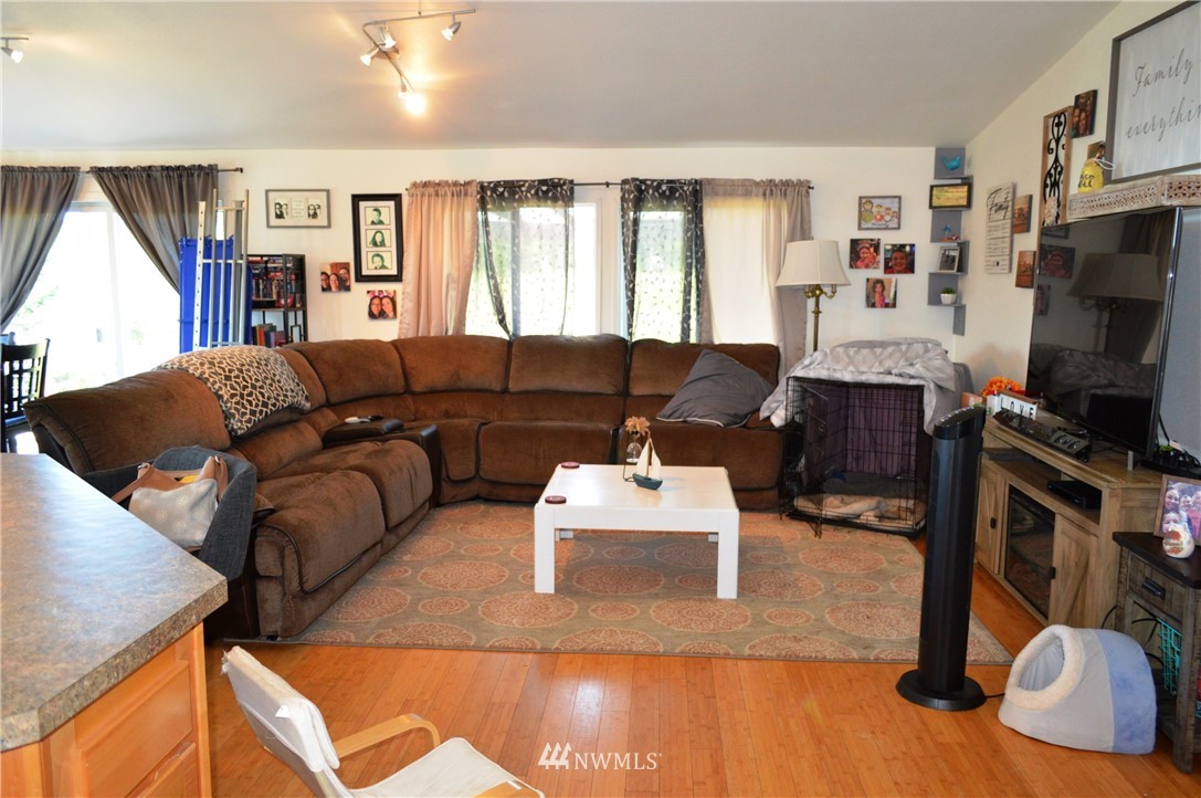 7855 Ham Road Custer, WA 98240 - Photo 13 of 39 a living room with furniture and a flat screen tv