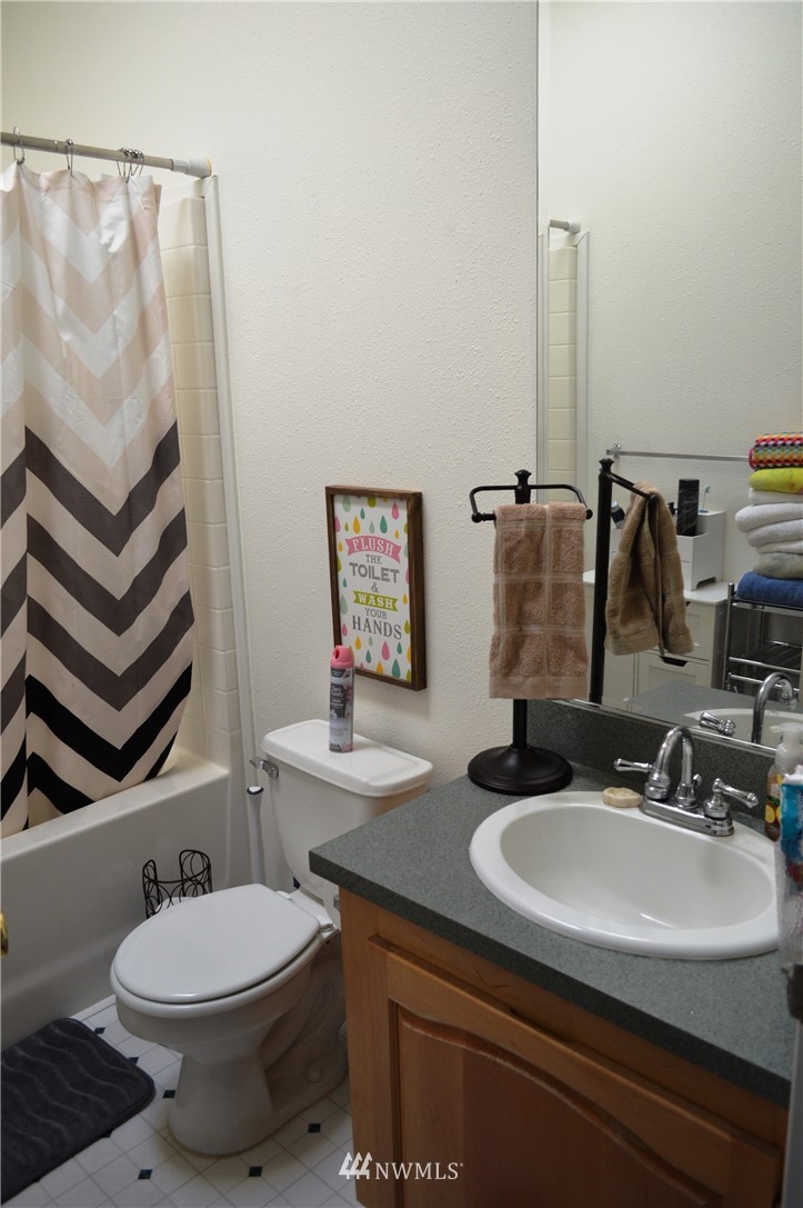 7855 Ham Road Custer, WA 98240 - Photo 17 of 39 a bathroom with a sink toilet and mirror