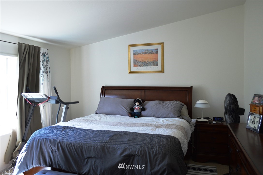 7855 Ham Road Custer, WA 98240 - Photo 18 of 39 a bedroom with a bed and a large mirror
