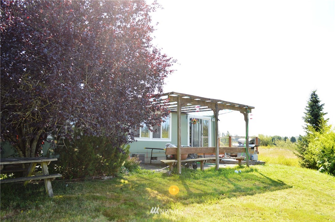 7855 Ham Road Custer, WA 98240 - Photo 5 of 39 a view of a house with backyard porch and sitting area