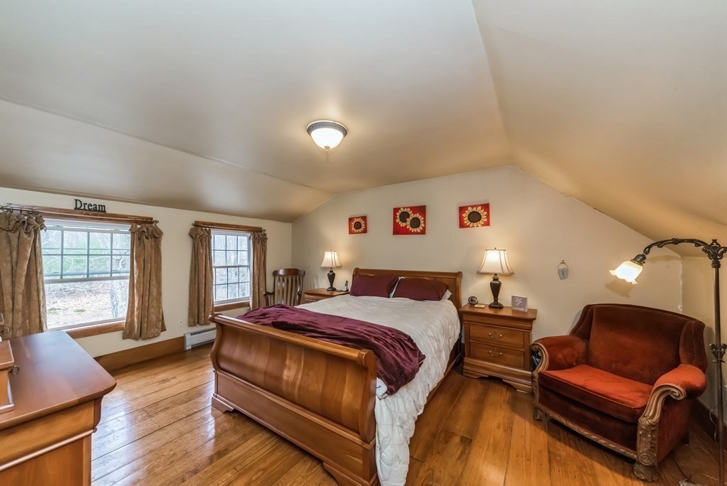 50 Old Poor Farm Road Ware, MA 01082 - Photo 7 of 33 a bedroom with a bed and wooden floor