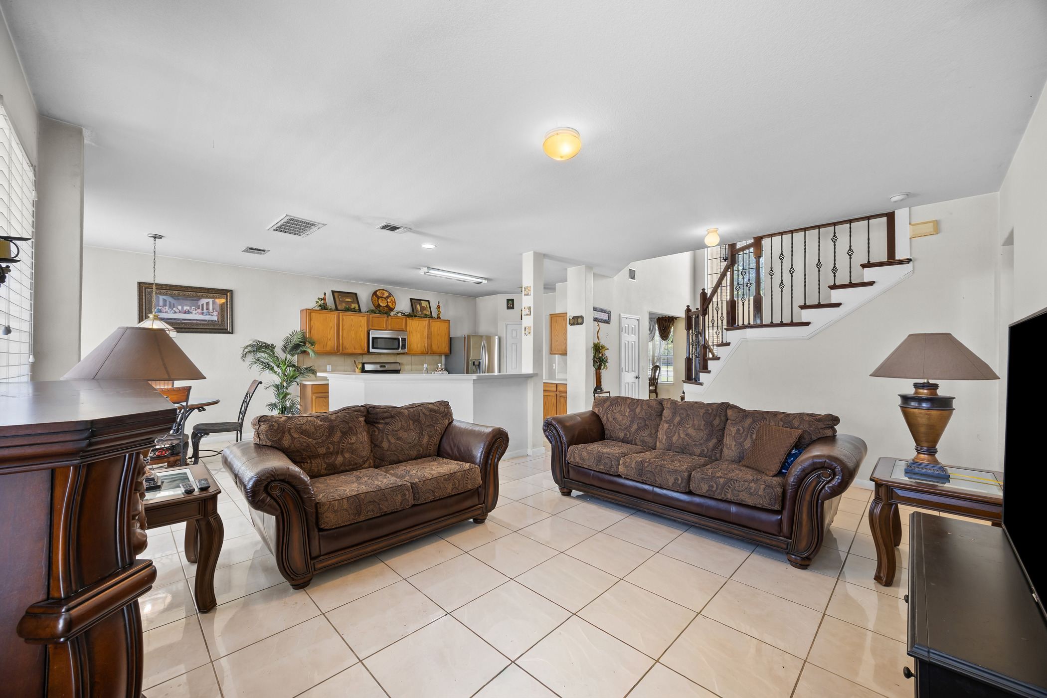 3502 Shiraz Loop Round Rock, TX 78665 - Photo 8 of 23 Living area featuring stairs and light tile patterned floors