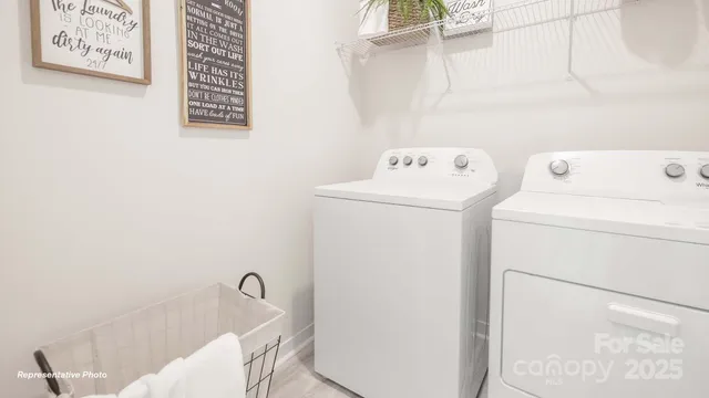 a bathroom with a bathtub and washer
