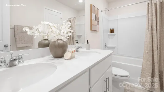 a bathroom with a sink vanity and a mirror