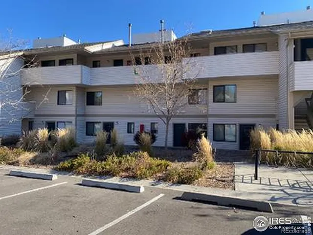 a front view of a building with sitting area