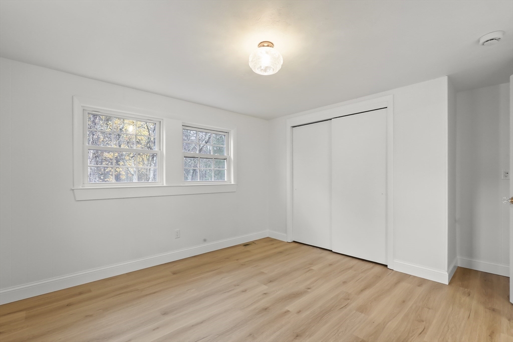 21 Weston Avenue Wareham, MA 02571 - Photo 11 of 23 a view of empty room with wooden floor and fan