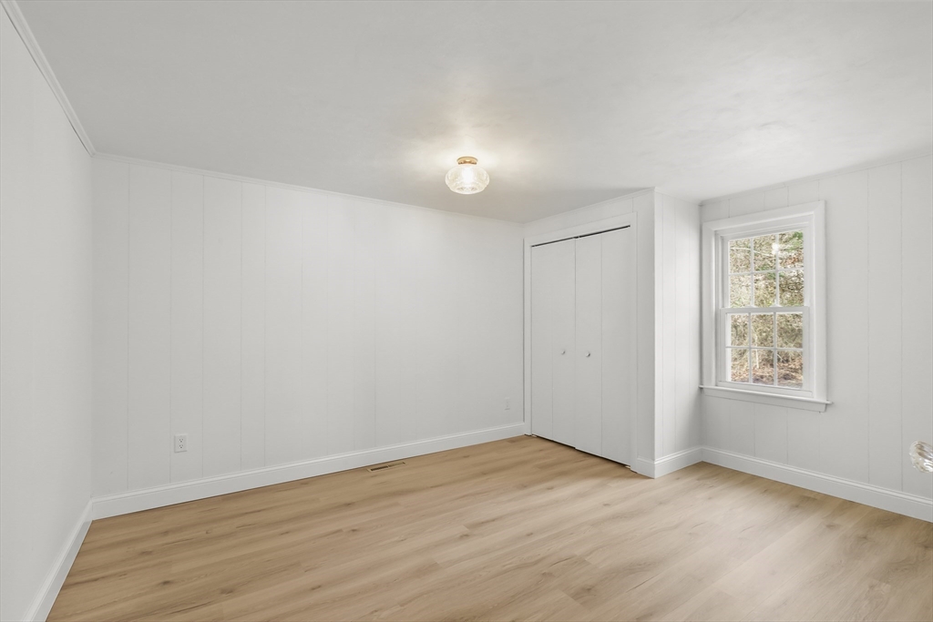 21 Weston Avenue Wareham, MA 02571 - Photo 14 of 23 an empty room with wooden floor and windows