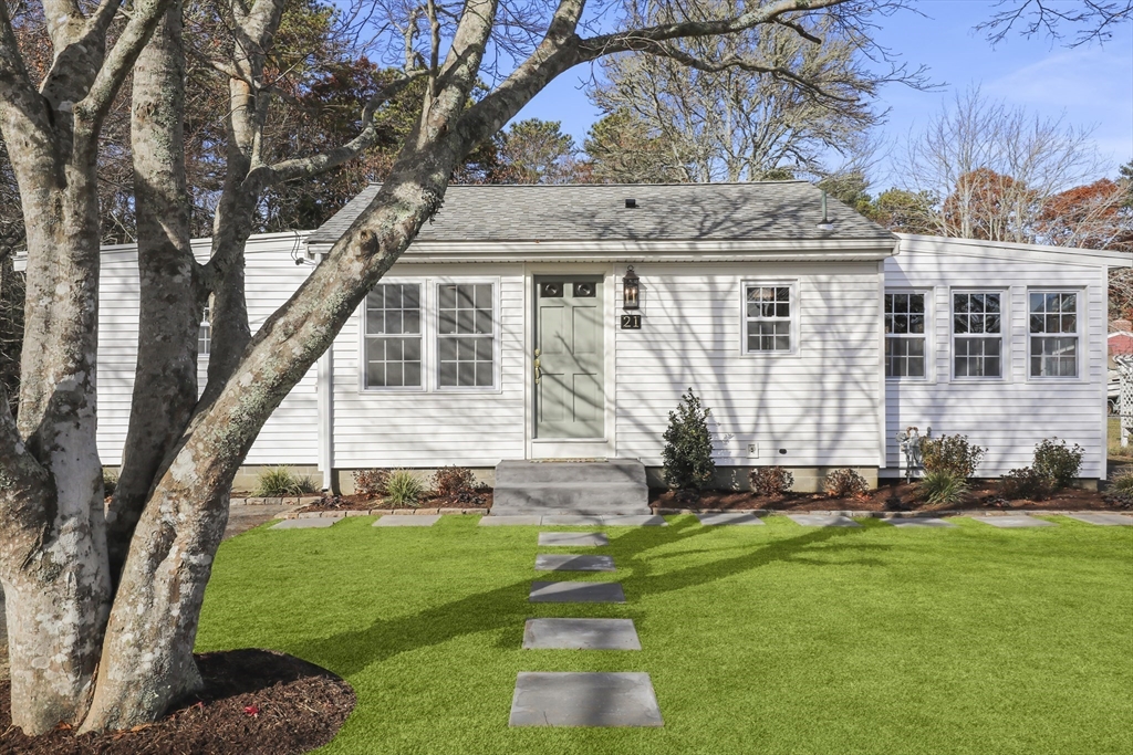 21 Weston Avenue Wareham, MA 02571 - Photo 2 of 23 a front view of a house with a yard