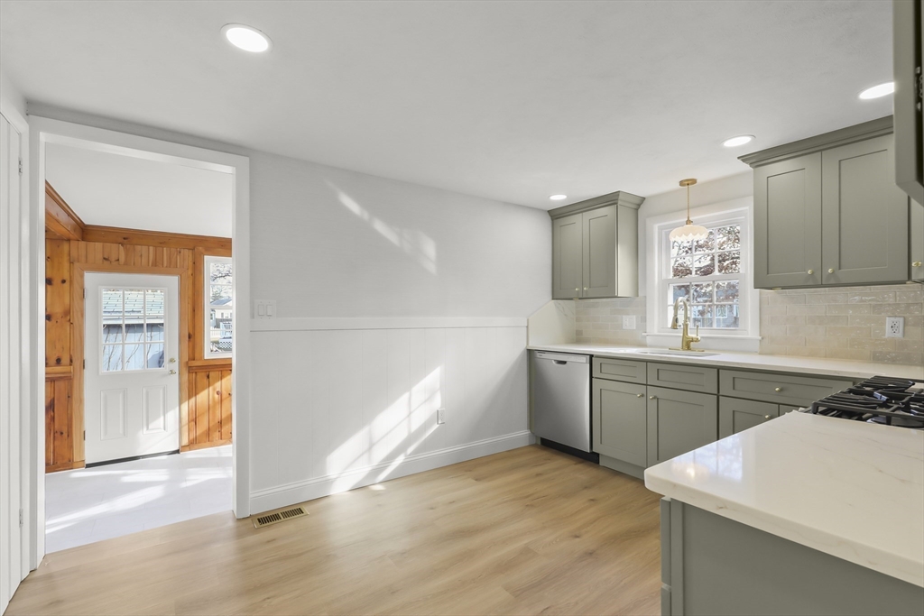 21 Weston Avenue Wareham, MA 02571 - Photo 5 of 23 a kitchen with a sink a stove cabinets and wooden floor