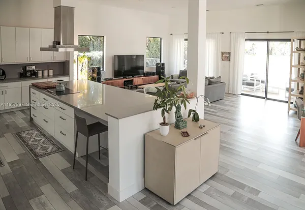 a kitchen with furniture a counter space a sink and appliances