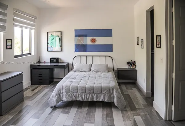 a room with furniture and flat screen tv