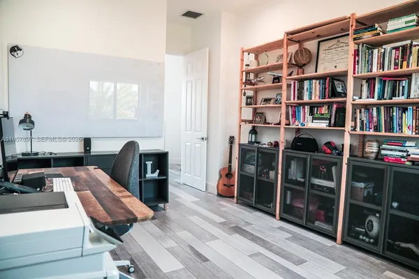 a en suite bathroom with a tub shower and sink