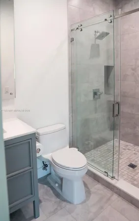 a bedroom with a large bed and a large window