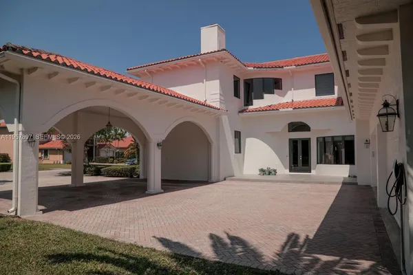 a front view of a house with entrance gate
