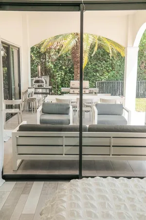 a bedroom with furniture and wooden floor