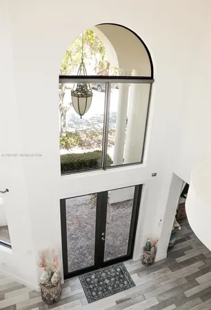 a view of wooden floor with a rug