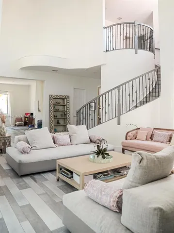 a living room with furniture and a table