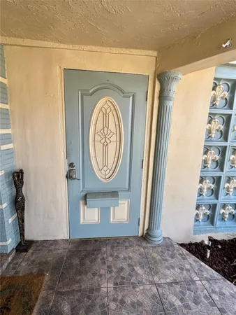 a view of a storage and utility room with washer and dryer