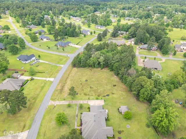a view of a swimming pool with a yard