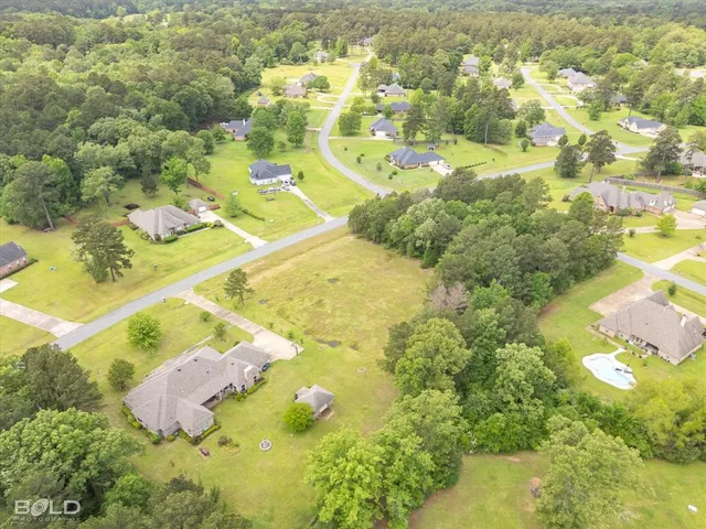 a view of residential houses with swimming pool