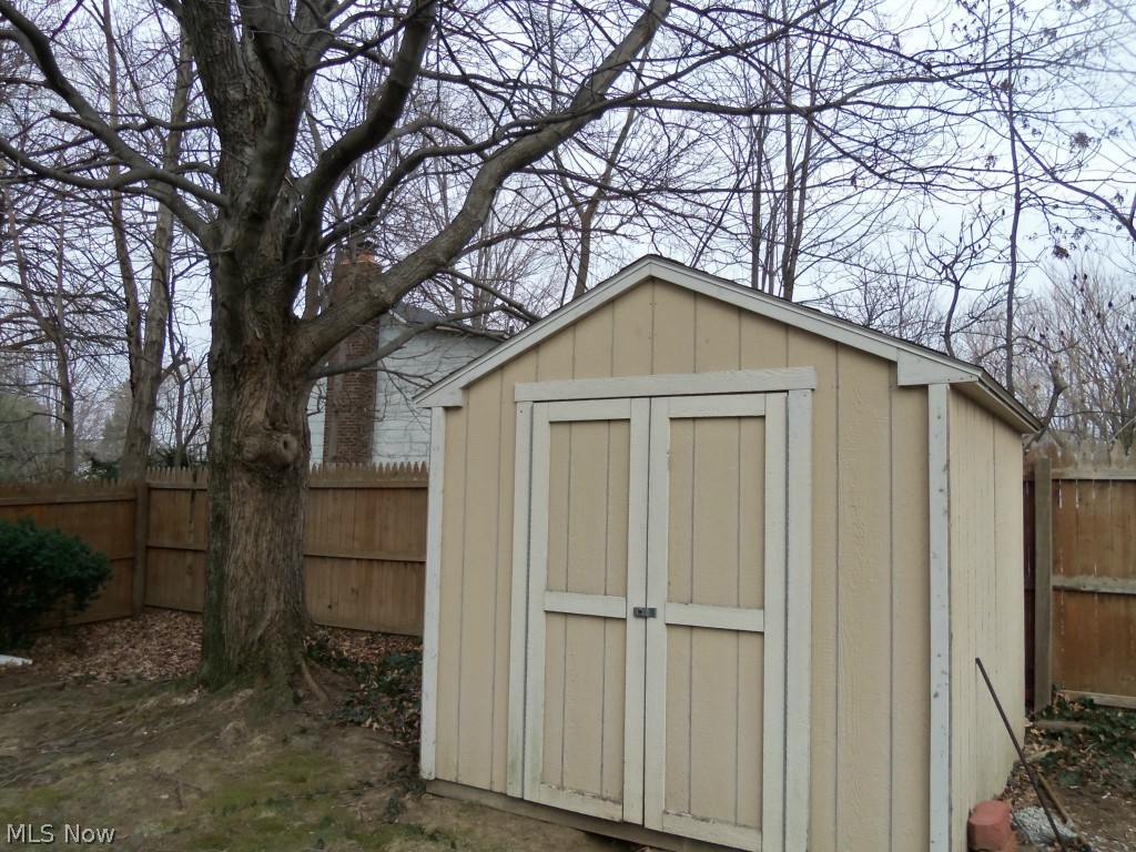5 Prentice Road Painesville, OH 44077 - Photo 16 of 16 YOU WILL NEVER LACK SPACE FOR ALL THE OUTDOOR EQUIPMENT AND TOYS WITH THE OVER SIZED GARAGE AND SHED.