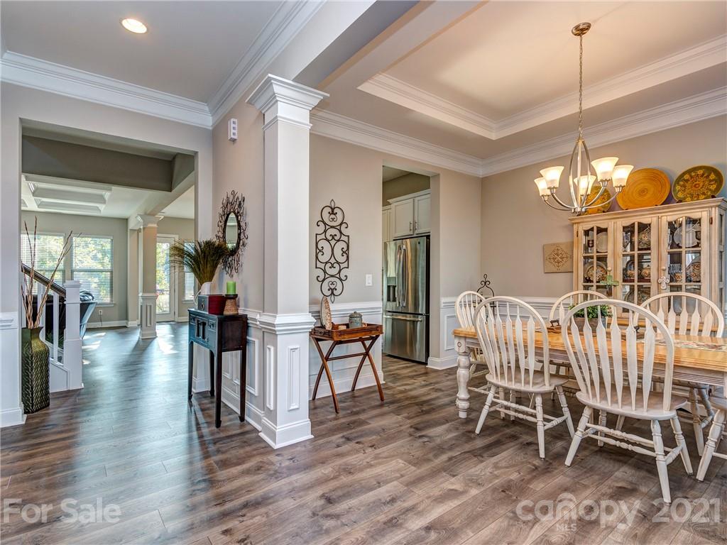 10007 Sunset Ridge Midland, NC 28107 - Photo 3 of 34 a view of a dining room with furniture window and wooden floor