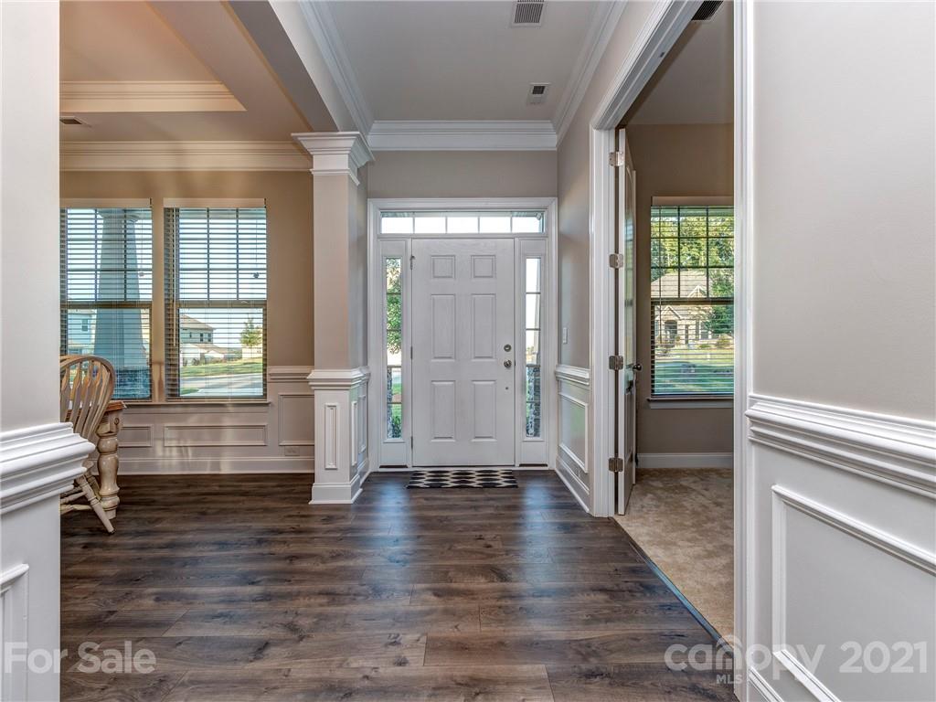 10007 Sunset Ridge Midland, NC 28107 - Photo 5 of 34 a view of an entryway with wooden floor and windows