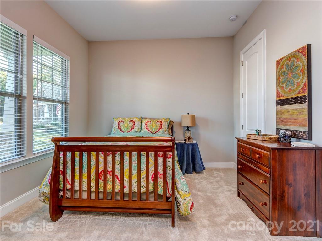10007 Sunset Ridge Midland, NC 28107 - Photo 8 of 34 a bedroom with a bed and wooden floor