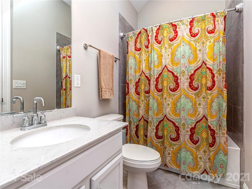 10007 Sunset Ridge Midland, NC 28107 - Photo 9 of 34 a bathroom with a sink and a toilet