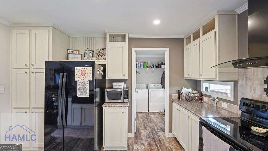876 Hires Road Jesup, GA 31545 - Photo 11 of 30 a kitchen with a refrigerator and a stove top oven