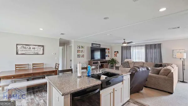a view of a dining room with furniture window and outside view