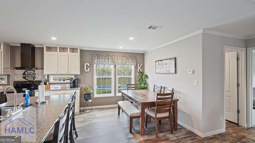 876 Hires Road Jesup, GA 31545 - Photo 13 of 30 a view of a dining room with furniture window and outside view