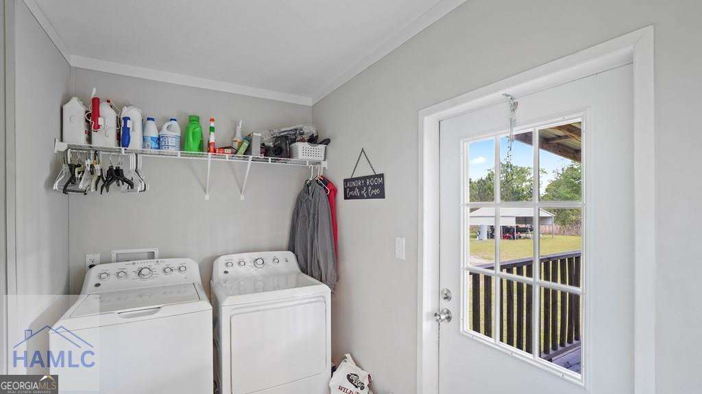 876 Hires Road Jesup, GA 31545 - Photo 14 of 30 a view of storage and utility room with washer and dryer